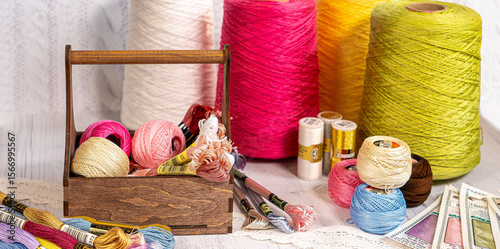 Threads in reels. Colored bobbins for embroidery knitting hobby accessories creativity.