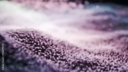 Abstract undulating surface with particles creates a dreamy and colorful background