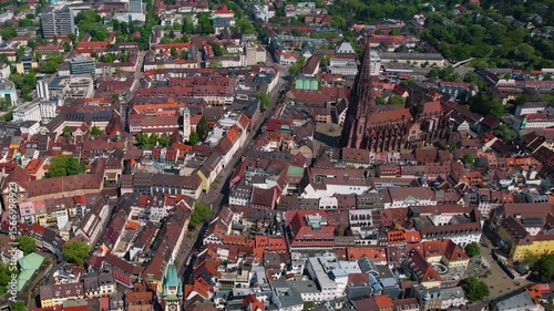 Aerial panorama view around the old town of the city Freiburg im Breisgau on a sunny summer day in the Germany.
