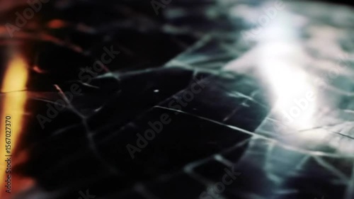 Abstract cracked surface with colorful light leak creates dynamic effect
