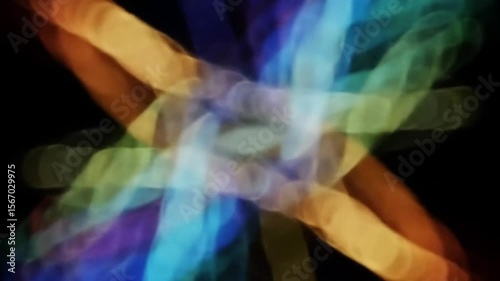 Abstract colorful light patterns dance and intertwine in a dynamic display