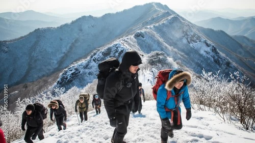 Winter Mountain Ascent: Hikers Trekking Through Snowy Landscape in South Korea