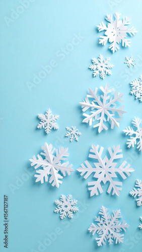 White Paper Snowflakes Falling Against a Soft Blue Background Creating a Wintery Design
