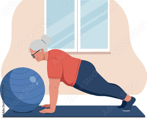 Senior woman exercising with blue fitness ball indoors on yoga mat natural light 