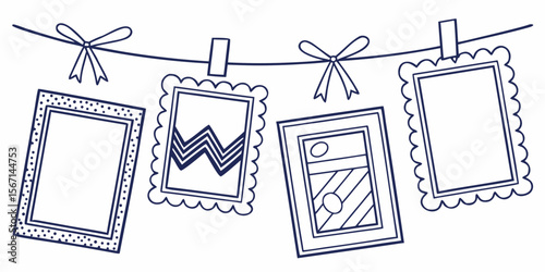 Four hand drawn picture frames hanging on a line with ribbons and clips isolated on white background