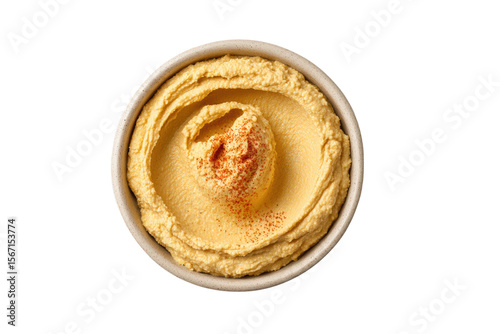 PNG Creamy hummus with paprika garnish in a bowl