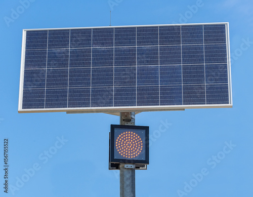 traffic lights powered by a solar panel with a battery