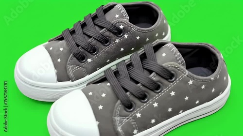 Wallpaper Mural Children shoes on green screen Torontodigital.ca