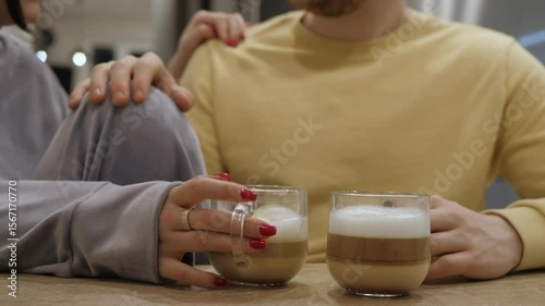Loving couple enjoys tender moment over cup of coffee. It is beautiful romance that creates warm atmosphere