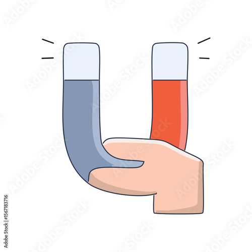 A hand holding a magnet