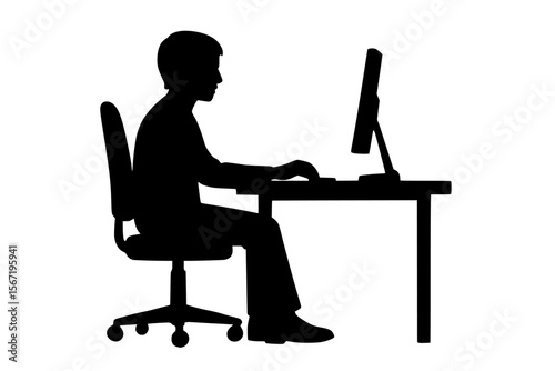 Silhouette of a person sitting at a desk using a computer