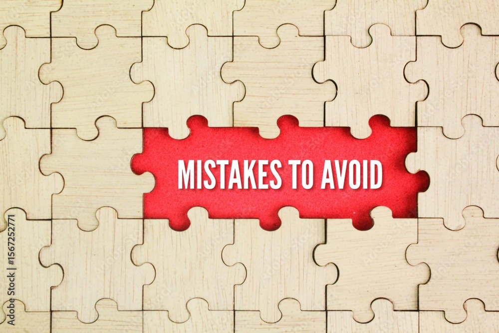 Fototapeta premium Wooden puzzle with the word Mistakes to Avoid. To keep away from or prevent oneself from making mistakes or blunders.