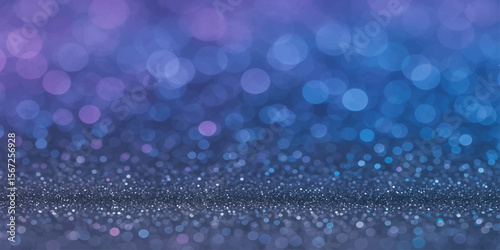 Bright blue water drops sparkle like festive holiday lights against a blurred, wintery night sky, creating a shimmery pattern