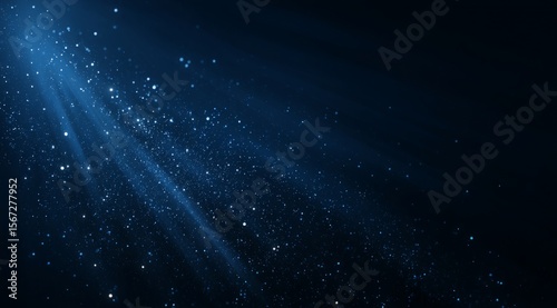 Blue Light Rays with Glitter on Dark Background