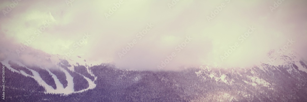 Obraz premium Snow covered mountain during sunset