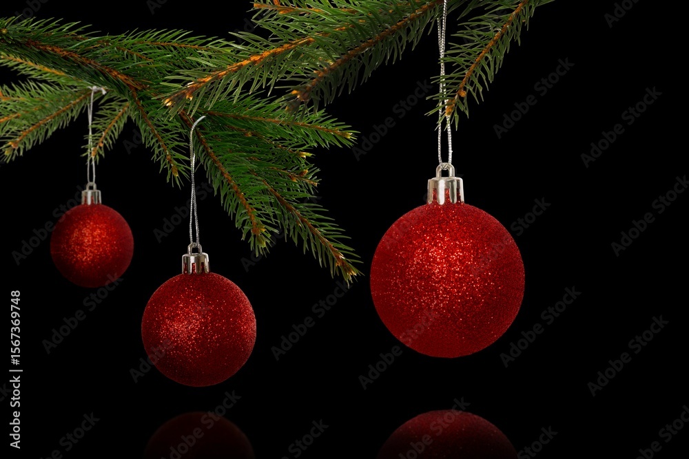 Obraz premium Three red glitter baubles are hanging from lush pine branch in 3D render with dark backdrop