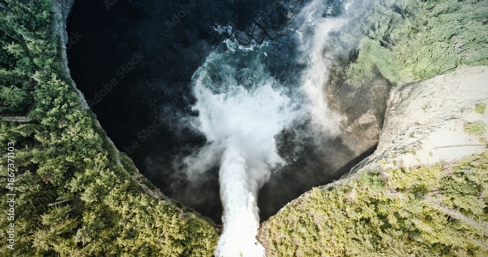 Fototapeta premium Waterfall that flows into a lake in a forest