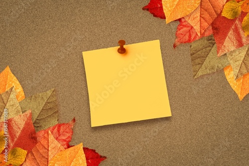 Autumn leaves with yellow note