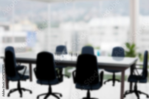 Flat design office is showing wooden table with swivel chairs, glasses, pen holder, potted plant