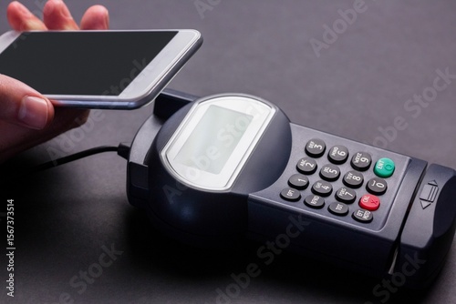 Man using smartphone to express pay