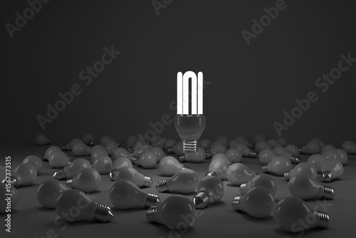 Composite image of lit energy efficient lightbulb over bulbs