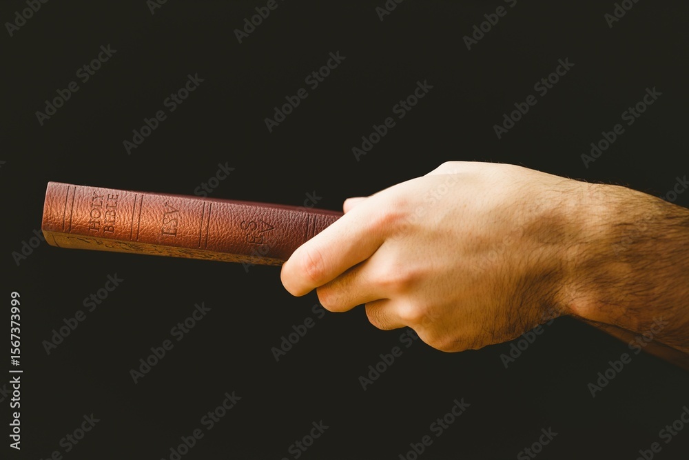 Fototapeta premium Close-up of hand holding Bible