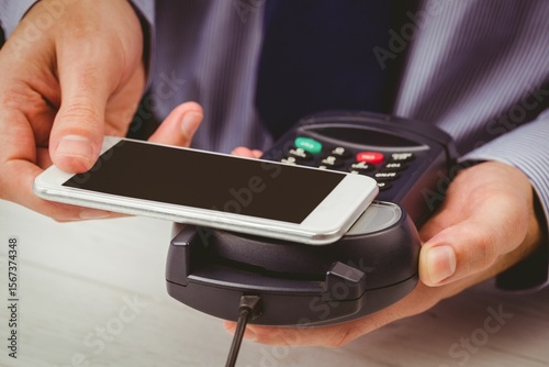 Man using smartphone to express pay