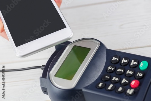 Man using smartphone to express pay