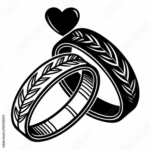 Intertwined wedding rings adorned with leaf motifs and a heart symbol