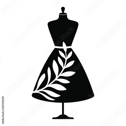 Black silhouette of a dress on a mannequin with a white leaf pattern