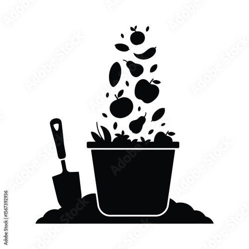 Black silhouette of a bucket overflowing with fruits and a garden trowel in soil