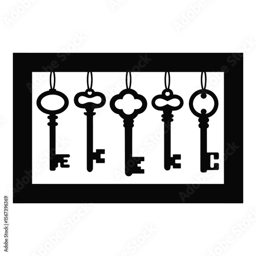 Five antique skeleton keys hanging in a row inside a black frame