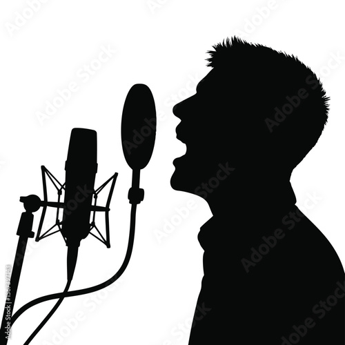 Silhouette of a man singing into a professional studio microphone