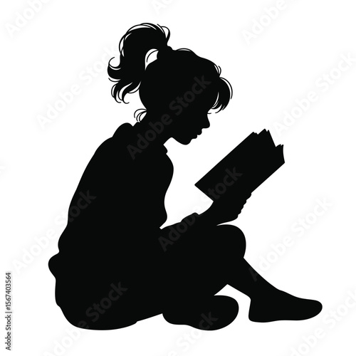 Silhouette of a young girl with a ponytail reading a book while sitting