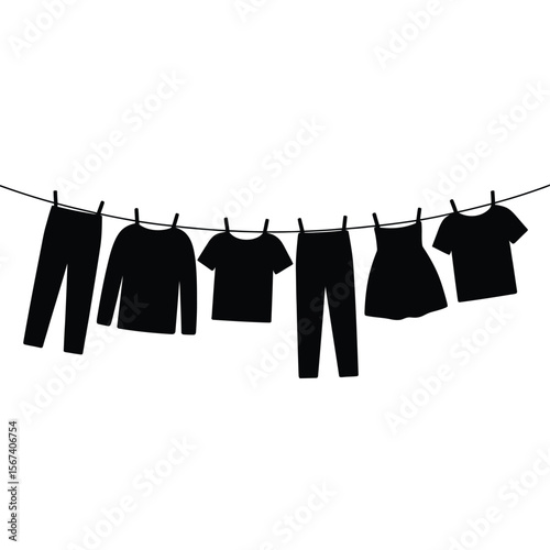 Black silhouette of various clothing items drying on a clothesline