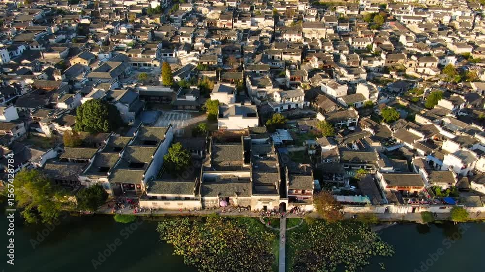 Explore stunning aerial views of Hongcun, a UNESCO World Heritage site in Anhui province during golden hour