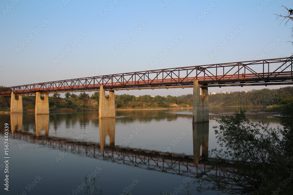 Fototapeta premium bridge over the river at sunset, Gold Bar Park, Edmonton, Alberta