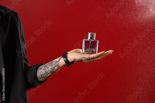 Tattooed young man with per...