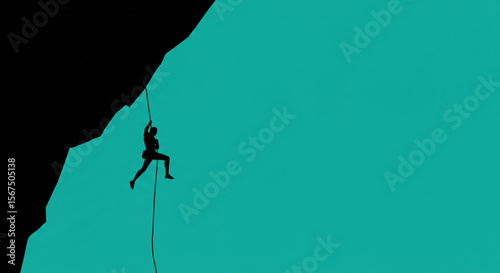 Silhouette of a rock climber descending a steep cliff face using a rope.