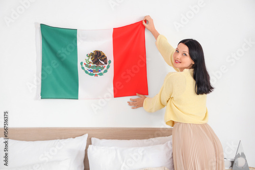 Young woman hanging Mexican...