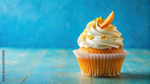 Colorful orange cupcake with a swirly design on a blue background