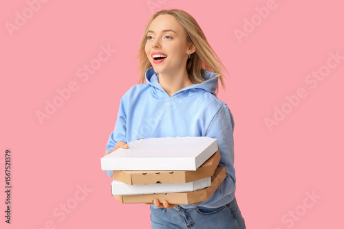 Young happy woman holding c...