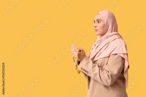 Young Muslim woman with bea...