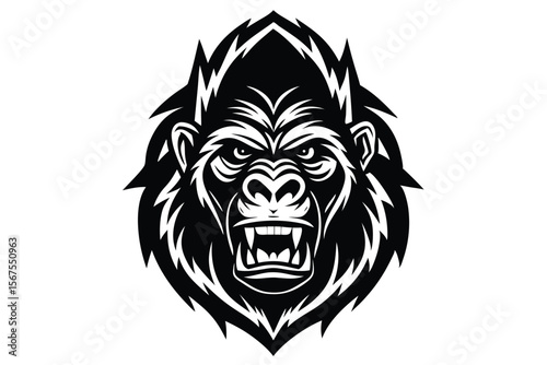 Fierce gorilla head stares forward with a strong and powerful presence dominating the foreground