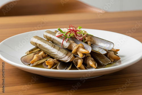 Razor Clams: These elongated, bivalve mollusks are known for their sweet, delicate flavor and tender texture.