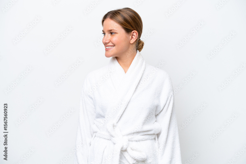 Young pretty blonde woman in bathrobe isolated on white background looking side Young pretty blonde woman in bathrobe isolated on white background looking side