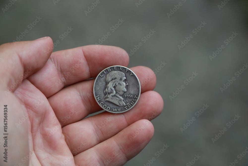 Fototapeta premium Old coin half dollar in hand