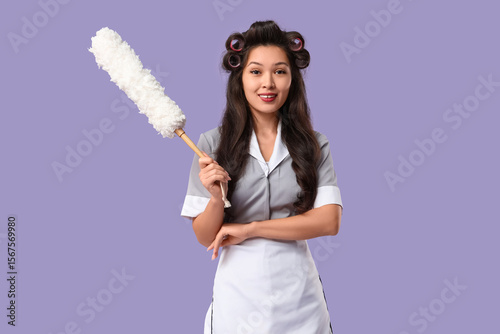 Young Asian chambermaid wit...