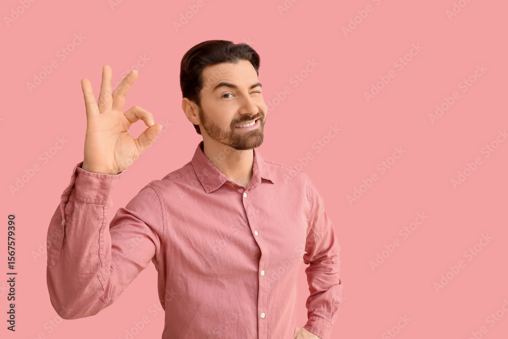 Fototapeta premium Confident Man Winking with OK Gesture