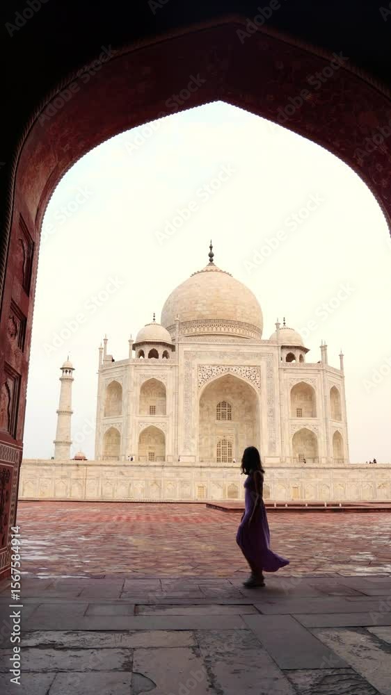 vertical Tourist walking at Taj Mahal in Agra, India